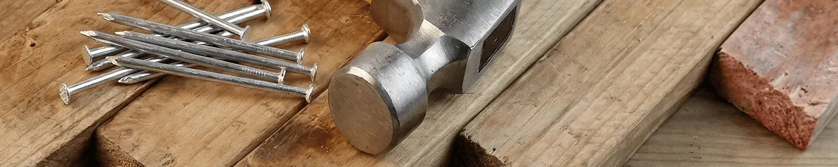 Hammer and nails on hardwood flooring boards in Irvine, CA